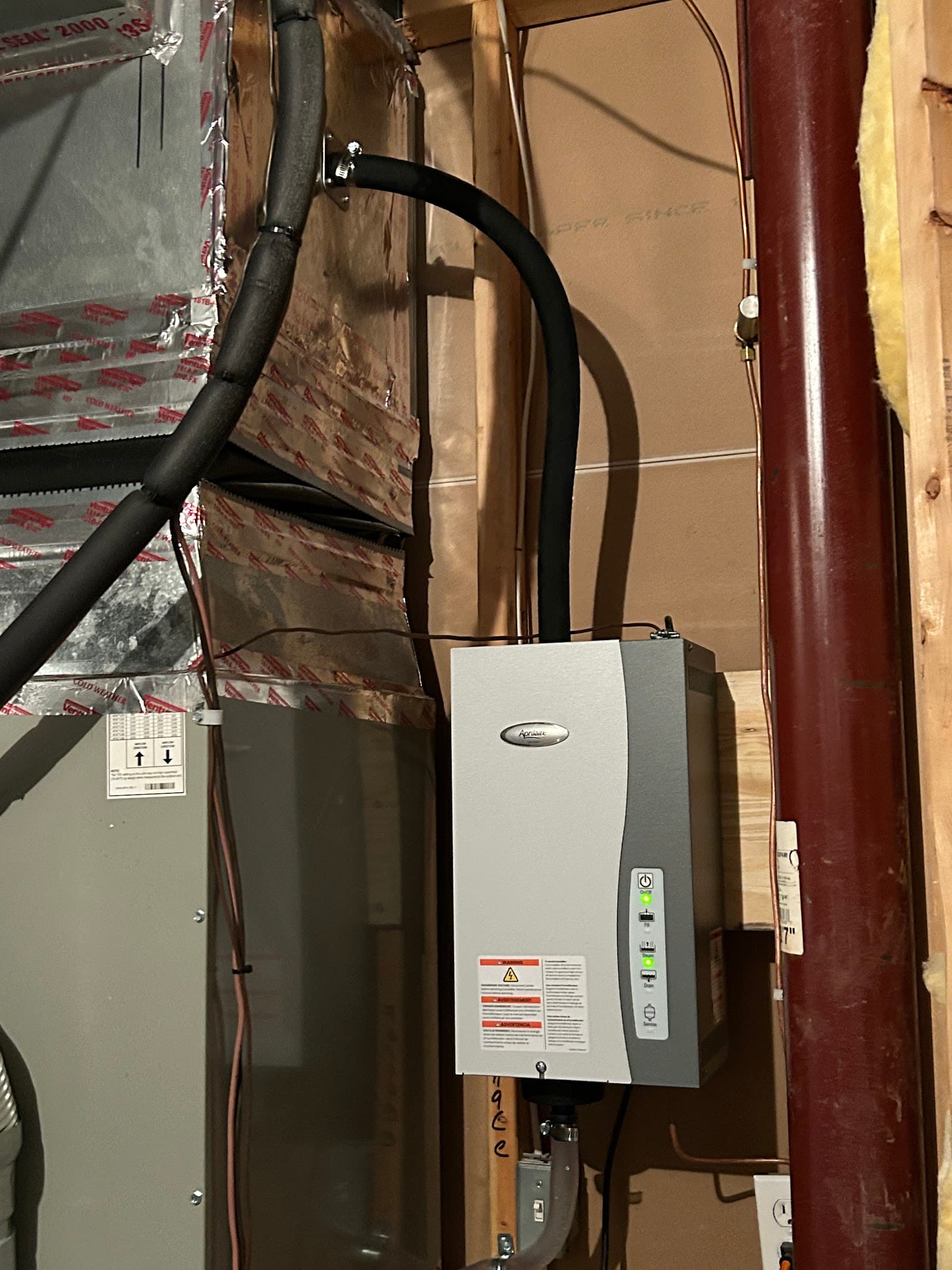 BlueStar Air Mechanical technician servicing a residential HVAC system in Northern Virginia